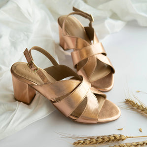 bold rose gold block heels party wear in white background