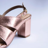 bold rose gold block heels party wear in white background buckleshot