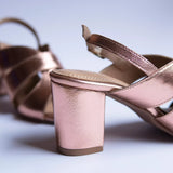 bold rose gold block heels party wear in white background heel shot
