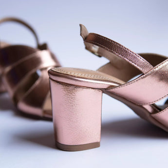 bold rose gold block heels party wear in white background heel shot