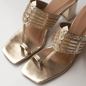 classic gold kolhapuri heels close up shot