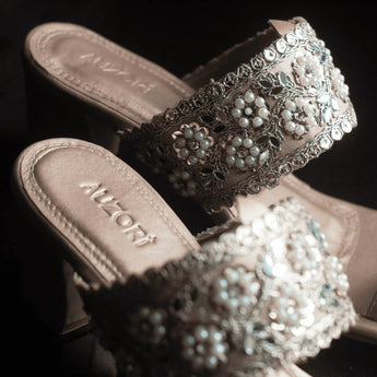 gleaming gold embroidered block heels close up shot