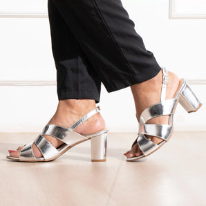 woman wearing bold silver party block heels