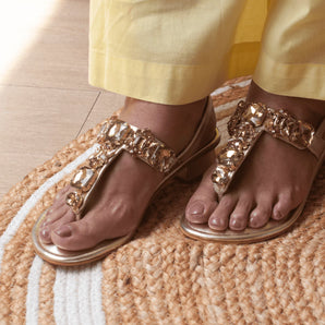 woman wearing radiant gold rhinestone block heels