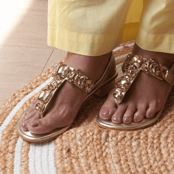 woman wearing radiant gold rhinestone block heels